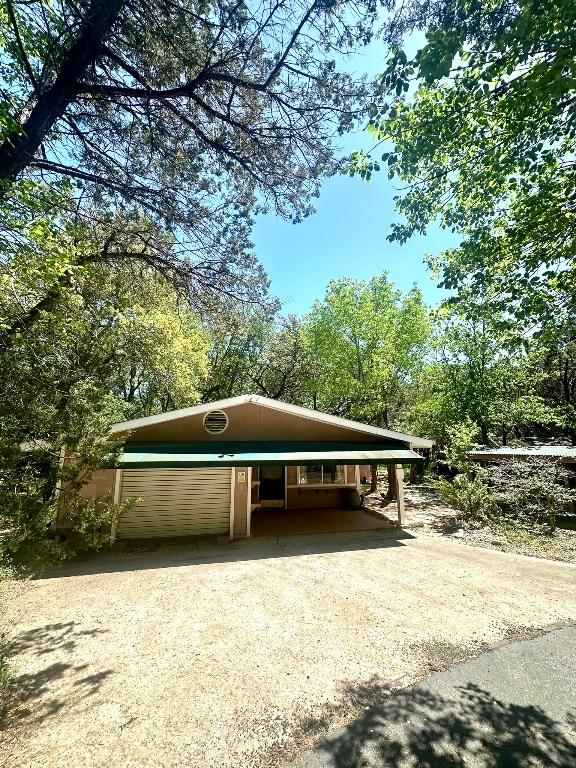 exterior space featuring dirt driveway