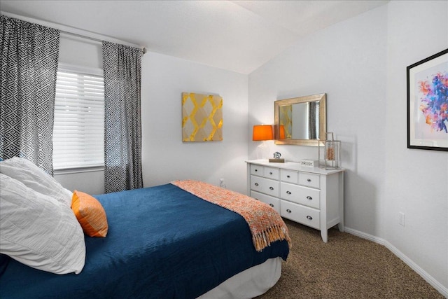 bedroom featuring vaulted ceiling, baseboards, and carpet floors