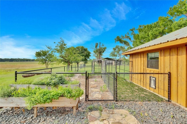 view of yard featuring a gate and a garden