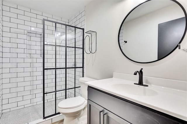 full bath with vanity, toilet, and a stall shower