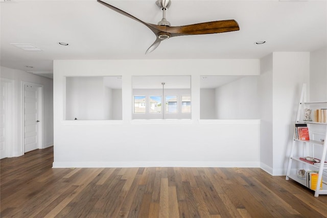 empty room featuring recessed lighting, wood finished floors, baseboards, and ceiling fan