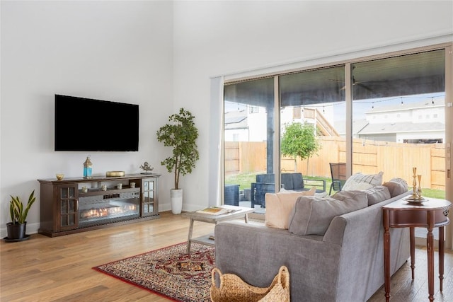 living room with wood finished floors and baseboards