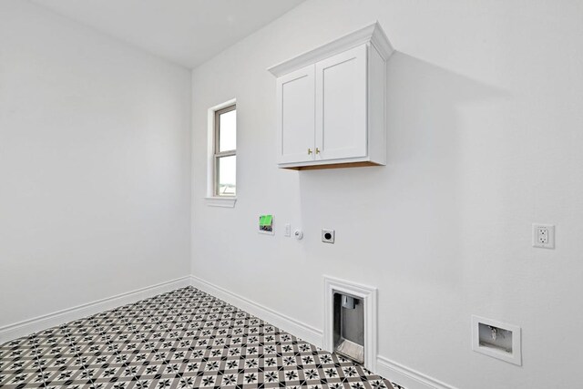 905 Crestone Stream Dr, Austin, TX 78738 - washroom with hookup for an electric dryer, cabinet space, light flooring, hookup for a gas dryer, and washer hookup