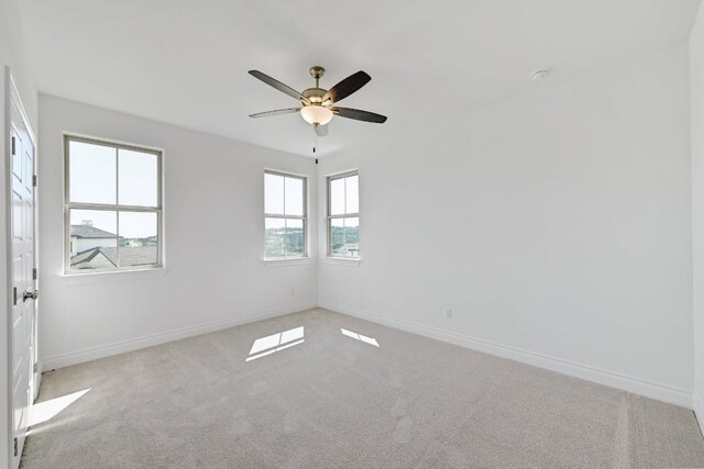 905 Crestone Stream Dr, Austin, TX 78738 - carpeted spare room with baseboards and ceiling fan