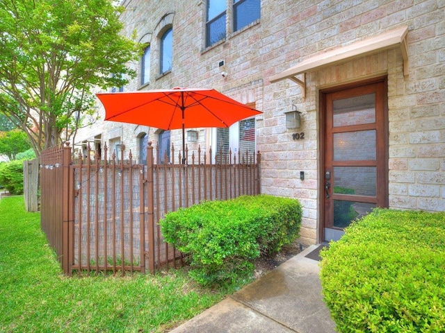 1202 S Flores St Unit 102, San Antonio, TX 78204 - entrance to property with stone siding