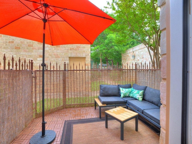 view of patio / terrace with fence and an outdoor hangout area