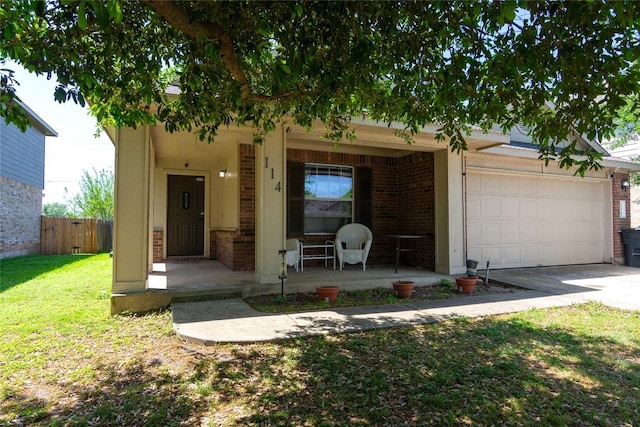 114 Mossy Rock Cv, Hutto, TX 78634 - view of front of home with a porch, brick siding, an attached garage, and concrete driveway