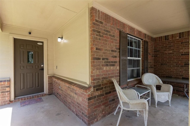 114 Mossy Rock Cv, Hutto, TX 78634 - doorway to property with brick siding and covered porch