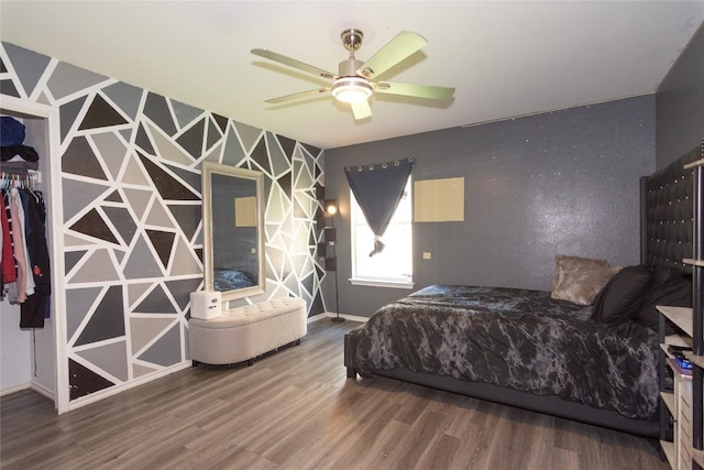 114 Mossy Rock Cv, Hutto, TX 78634 - bedroom with wood finished floors and baseboards