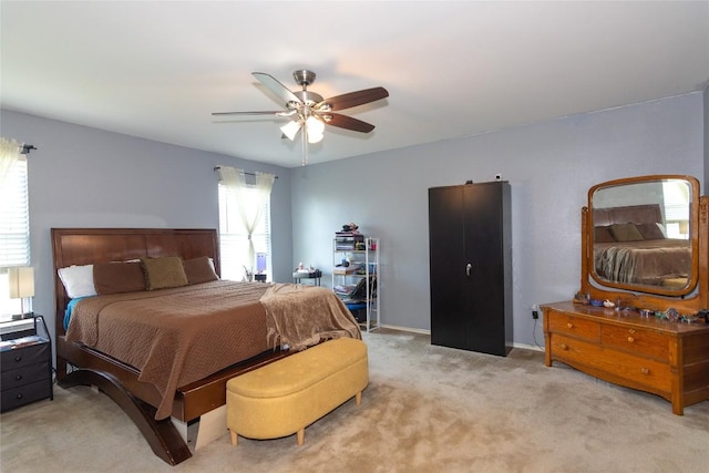 114 Mossy Rock Cv, Hutto, TX 78634 - bedroom with light carpet and ceiling fan
