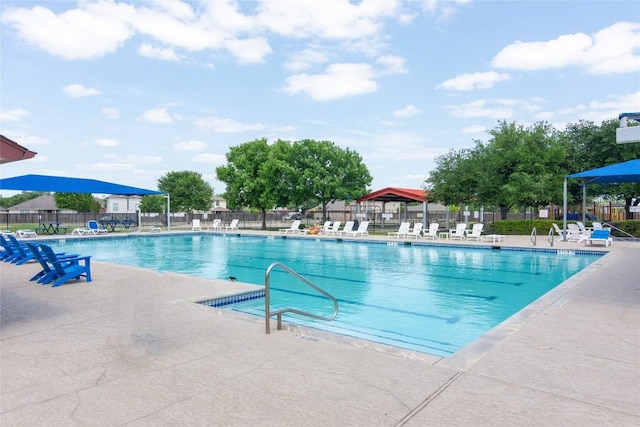 114 Mossy Rock Cv, Hutto, TX 78634 - community pool featuring a patio