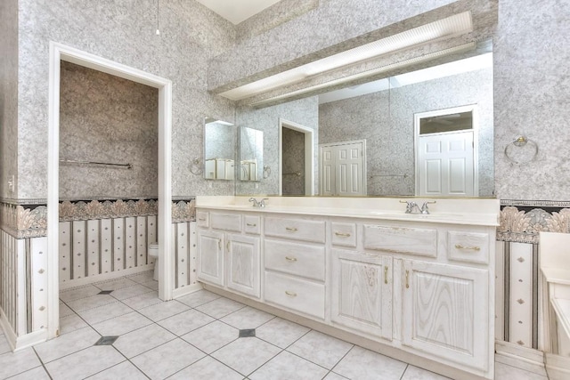 229 Whispering Wind Dr, Georgetown, TX 78633 - full bath with double vanity and tile patterned flooring