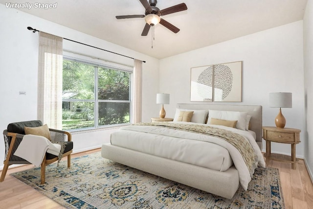 229 Whispering Wind Dr, Georgetown, TX 78633 - bedroom with light wood-style floors and a ceiling fan