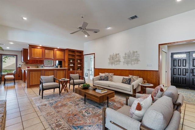 4602 Laurel Canyon Dr, Austin, TX 78731 - living area featuring light tile patterned floors, ceiling fan, recessed lighting, wainscoting, and wood walls