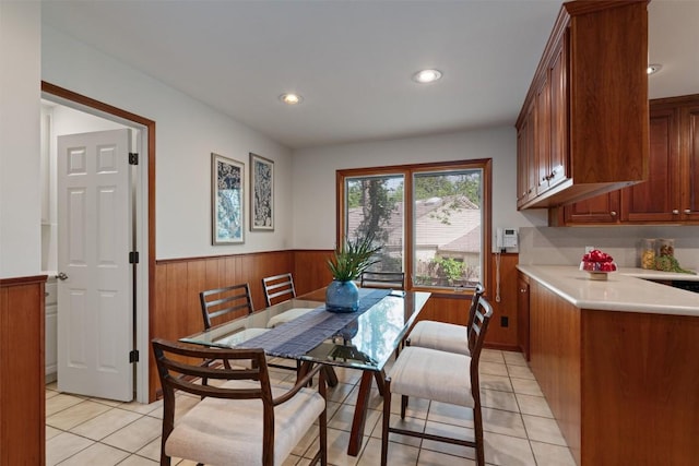 4602 Laurel Canyon Dr, Austin, TX 78731 - dining area featuring wainscoting, light tile patterned floors, wooden walls, and recessed lighting