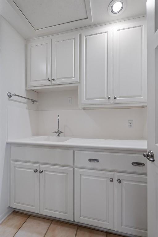 4602 Laurel Canyon Dr, Austin, TX 78731 - kitchen with white cabinets, light countertops, and light tile patterned floors