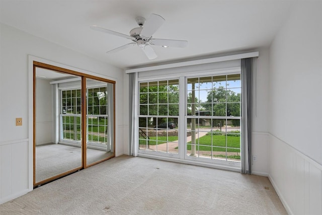4602 Laurel Canyon Dr, Austin, TX 78731 - carpeted empty room featuring wainscoting and ceiling fan