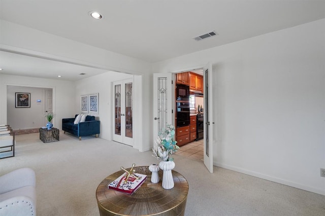4602 Laurel Canyon Dr, Austin, TX 78731 - living area with french doors, light carpet, and recessed lighting