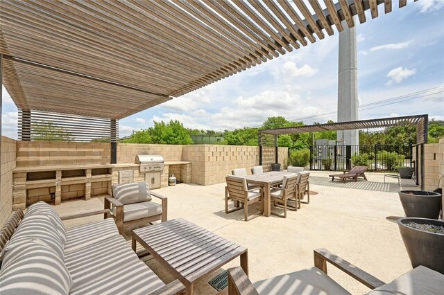 2050 Lohmans Spur Rd Unit 1302, Lakeway, TX 78734 - view of patio featuring an outdoor kitchen, area for grilling, outdoor dining space, fence, and an outdoor hangout area