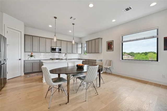 2050 Lohmans Spur Rd Unit 1302, Lakeway, TX 78734 - dining area with light wood finished floors, recessed lighting, and baseboards