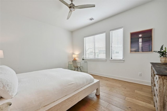 2050 Lohmans Spur Rd Unit 1302, Lakeway, TX 78734 - bedroom featuring light wood-style floors, baseboards, and a ceiling fan