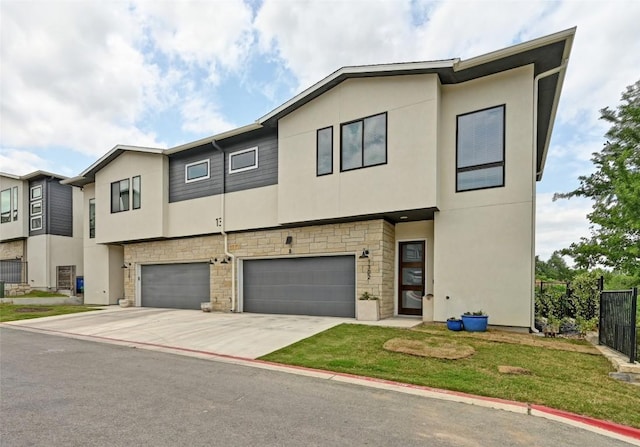 2050 Lohmans Spur Rd Unit 1302, Lakeway, TX 78734 - townhome / multi-family property with stucco siding, stone siding, and a garage