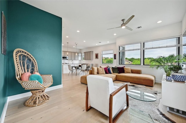 2050 Lohmans Spur Rd Unit 1302, Lakeway, TX 78734 - living area with light wood-style floors, recessed lighting, ceiling fan, and baseboards