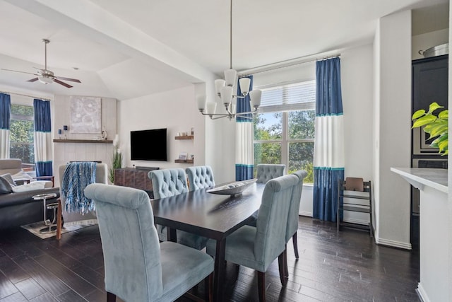3905 Veneto Cir, Leander, TX 78641 - dining area with dark wood-type flooring, a ceiling fan, and a chandelier