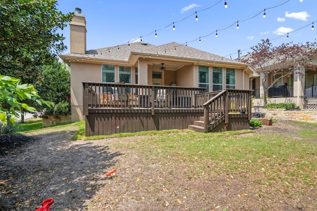 3905 Veneto Cir, Leander, TX 78641 - back of property with stucco siding, a chimney, a wooden deck, and a shingled roof