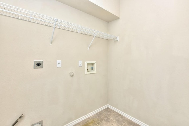 washroom featuring baseboards, hookup for a washing machine, electric dryer hookup, gas dryer hookup, and laundry area