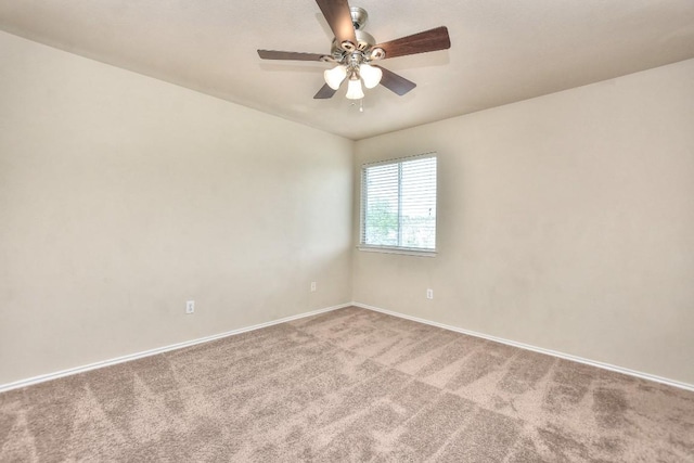 empty room with baseboards, carpet flooring, and ceiling fan