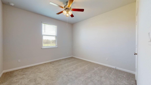 unfurnished room featuring baseboards, carpet, and ceiling fan