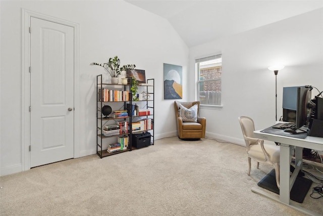 office space with lofted ceiling, baseboards, and carpet floors