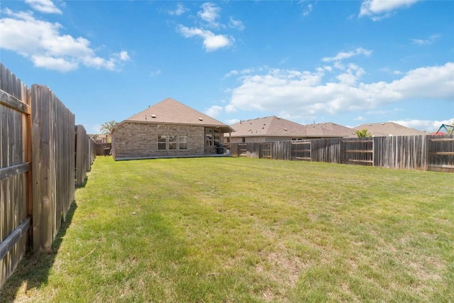 view of yard featuring a fenced backyard
