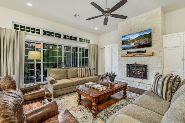 living room featuring visible vents, recessed lighting, a ceiling fan, wood finished floors, and a fireplace