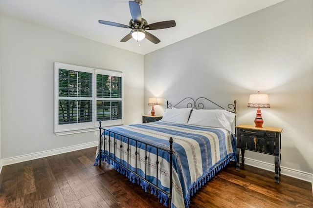 bedroom with wood-type flooring, baseboards, and ceiling fan