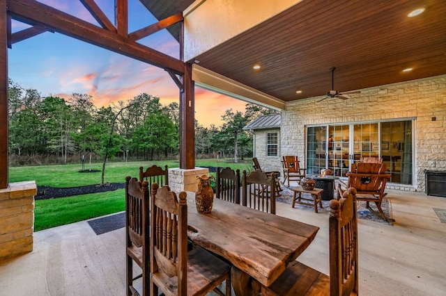 view of patio / terrace with a ceiling fan and outdoor dining space