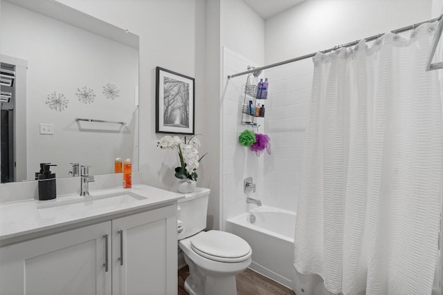 bathroom featuring shower / bath combo, toilet, vanity, and wood finished floors