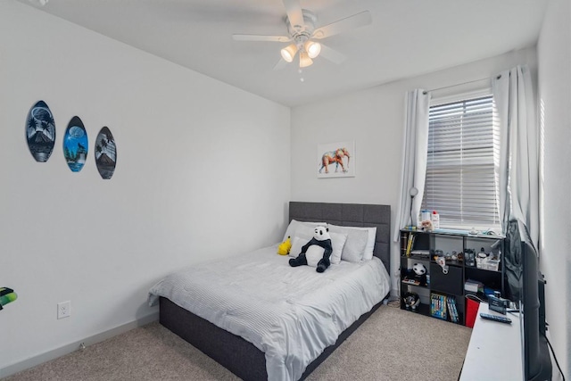 bedroom featuring baseboards, a ceiling fan, and carpet