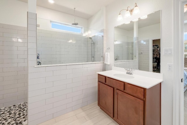 full bath featuring vanity and a walk in shower