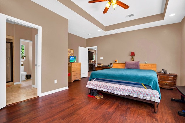 316 County Rd, Bastrop, TX 78602 - bedroom featuring wood finished floors, a raised ceiling, recessed lighting, and ceiling fan