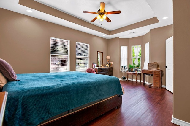 316 County Rd, Bastrop, TX 78602 - bedroom with dark wood-type flooring, recessed lighting, a raised ceiling, and a ceiling fan