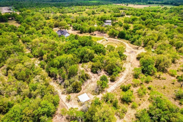 birds eye view of property with a wooded view