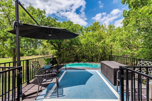 outdoor pool featuring a deck