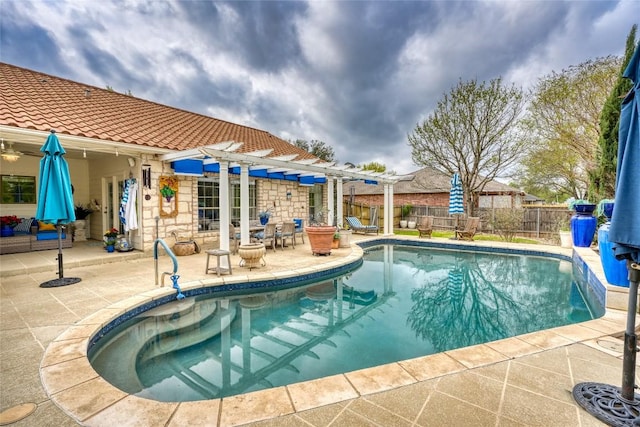 view of swimming pool with a pergola, a patio area, a fenced in pool, and a fenced backyard