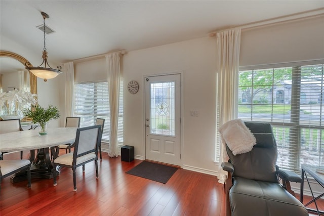 entryway with wood finished floors and visible vents