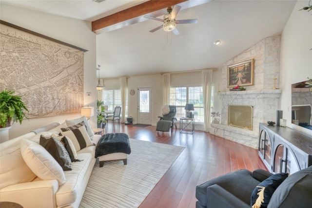 living room featuring high vaulted ceiling, beamed ceiling, ceiling fan, hardwood / wood-style floors, and a fireplace