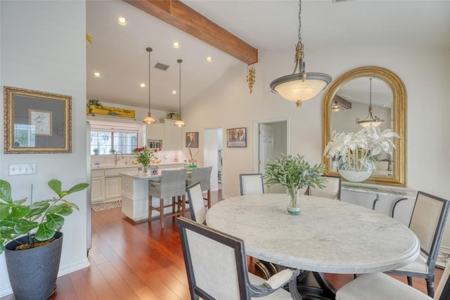 dining room with beam ceiling, dark wood-style flooring, visible vents, recessed lighting, and high vaulted ceiling
