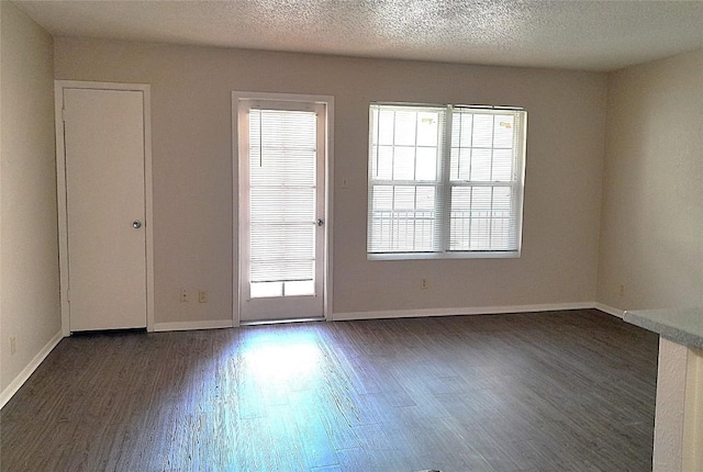 910 Duncan Ln Unit 27, Austin, TX 78705 - empty room featuring dark wood finished floors and a textured ceiling