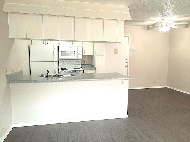 910 Duncan Ln Unit 27, Austin, TX 78705 - kitchen with white appliances, a peninsula, ceiling fan, dark wood-style floors, and light countertops